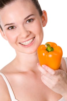 Portrait of pretty girl with ripe pepper of orange color