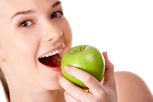 Portrait of pretty girl with open mouth eating green apple