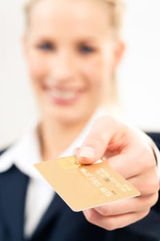 Close-up of plastic credit card in businesswomans hand