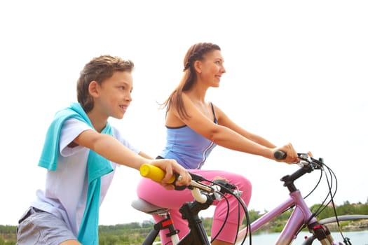 Mother and her son cycling together