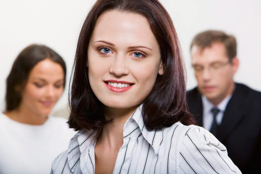 Female leader on the background of  her business team