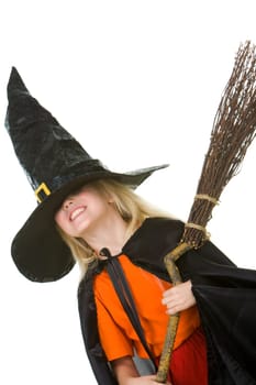 Photo of girl in halloween costume holding broom