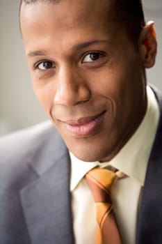 Portrait of successful white collar worker looking at camera and smiling