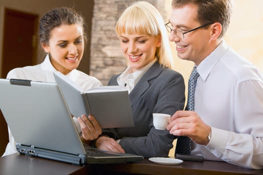 Confident business people are working together at meeting