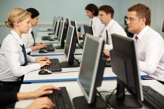 Photo of confident businesspeople doing some computer work