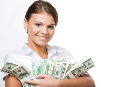 Smiling business woman holding lots of dollars in hands