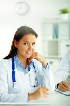 Portrait of confident female doctor looking at camera in hospital