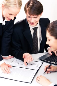 Three people gathered together around the table and planning