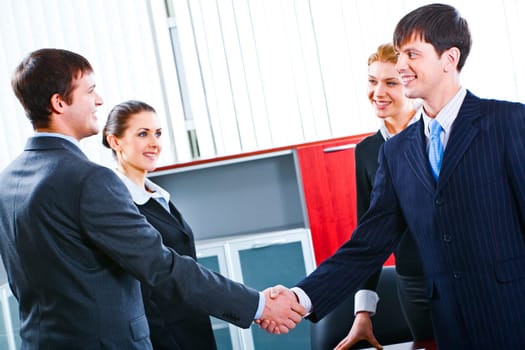 Successful handshake of confident business people making a deal