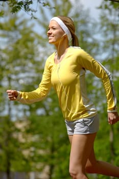 Portrait of a young woman jogging with a walkman