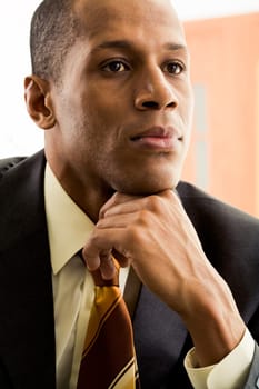 Portrait of thoughtful businessman thinking during work