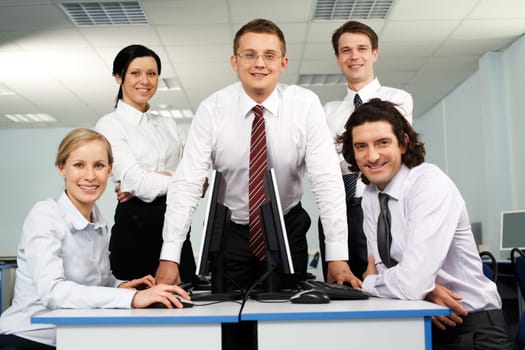 Portrait of smiling business group looking at camera
