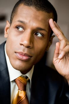 Pensive employee thinking of new ideas and looking aside