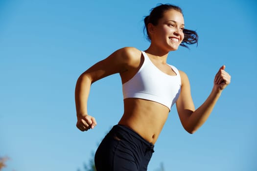 Portrait of a young woman jogging