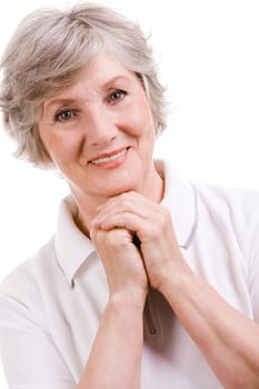 Portrait of mature woman smiling at camera over white background