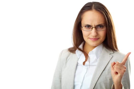 Portrait of annoyed businesswoman looking at camera with her forefinger raised