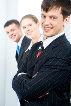 Row of successful business team with leader in front