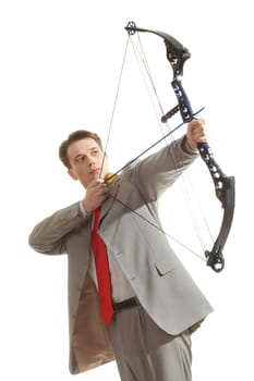 Portrait of concentrated male with crossbow in hands over white background
