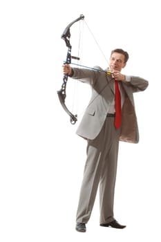 Portrait of courageous businessman holding crossbow and aiming at target