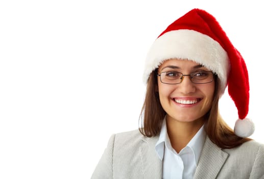 Portrait of happy businesswoman in Santa cap smiling at camera