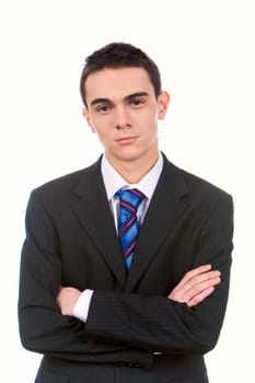 Portrait of young handsome businessman with crossed arms looking at camera