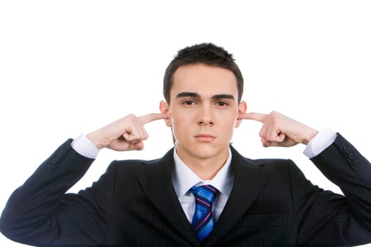 Portrait of smart man keeping his forefingers in ears showing his being annoyed