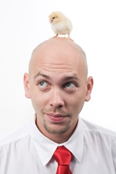 Photo of handsome man listening to chick peeping on his head