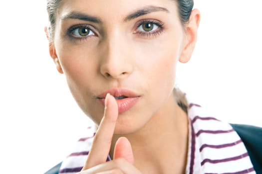 Portrait of young business woman with the finger near her lips