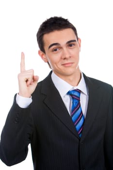 Attractive young businessman pointing his forefinger upwards with smile
