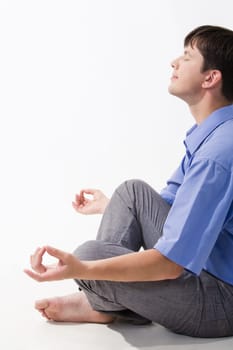 View of man doing yoga exercise and taking pleasure in it
