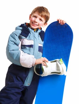 Portrait of happy boy with skateboard on white background