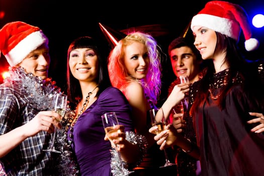 Portrait of modern young people enjoying themselves at New Year party