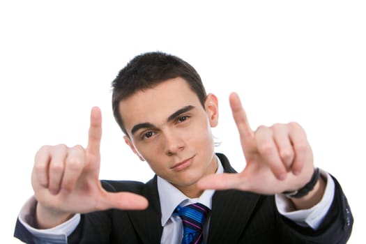 Image of handsome businessman showing his palms with stretched forefingers and thumbs