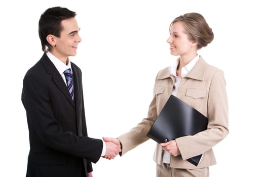 Portrait of successful business partners shaking hands after striking a deal