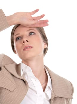 Portrait of tired female with her hand on forehead looking upwards