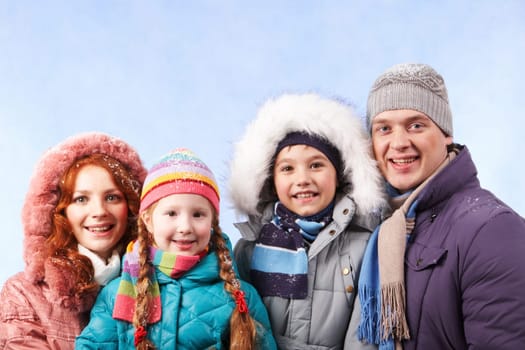 Happy family members looking at camera with smiles