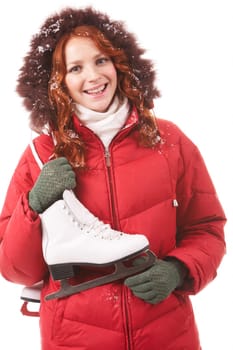 Portrait of smiling girl with skates looking at camera