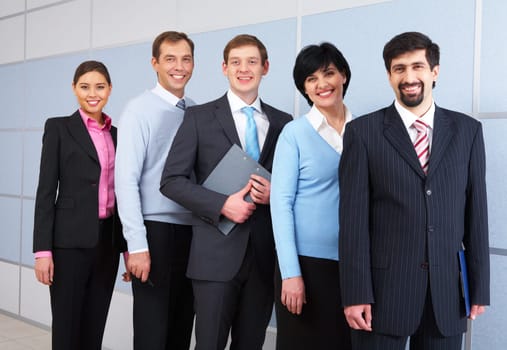 Photo of successful employees looking at camera