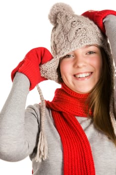 Portrait of beautiful young girl wearing grey knitted cap and sweater