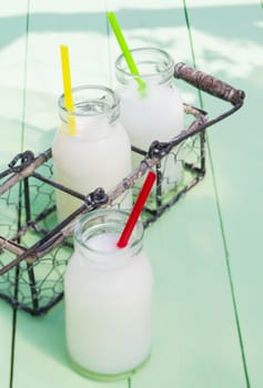 Some milky drinks in a tray for lunch time outdoors