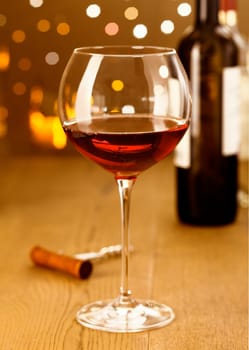 Elegant red wine with grapes on a festive background with beautiful Boketh