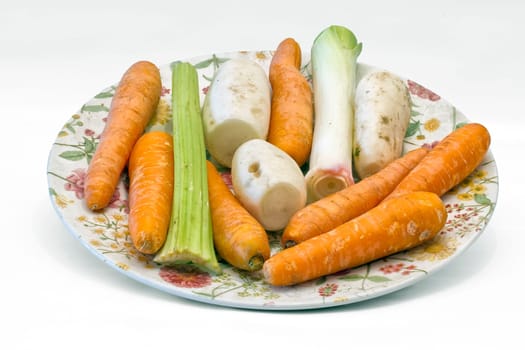 Prepared vegetables to cooked vegetable., fresh vegetable in plate,  isolated on white.