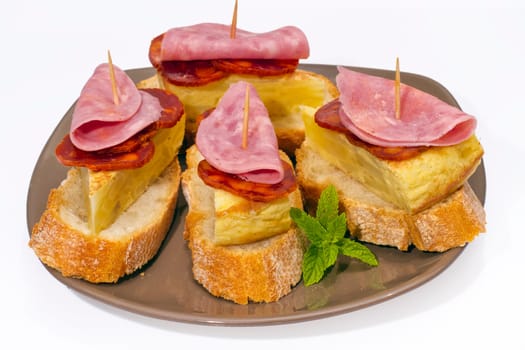 Spanish omelette with chorizo Iberico, typical cover montadito