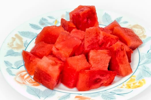 Fresh watermelon bowl with cubes on pure white background