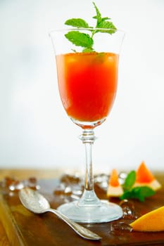 Blood Orange refreshing Drink on a wooden board