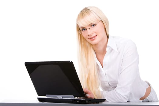 Photo of beautiful blonde looking at camera with laptop in front