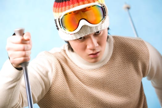 Portrait of healthy sportsman skiing on resort