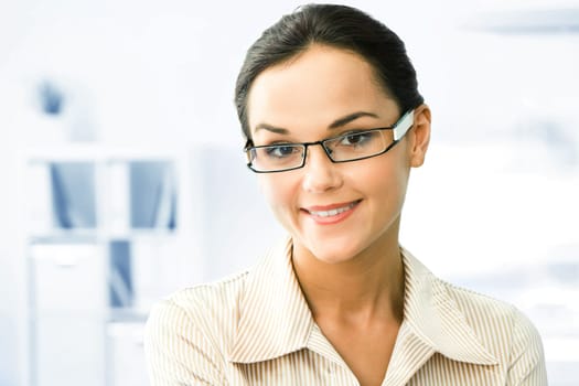 Face of clever business woman in the office