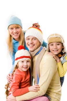 Happy family looking at camera with smiles