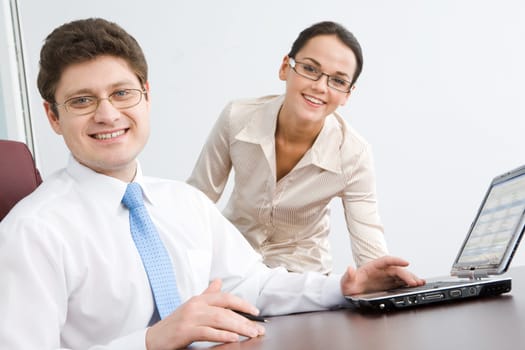 Photo of smiling boss looking at camera with woman on background